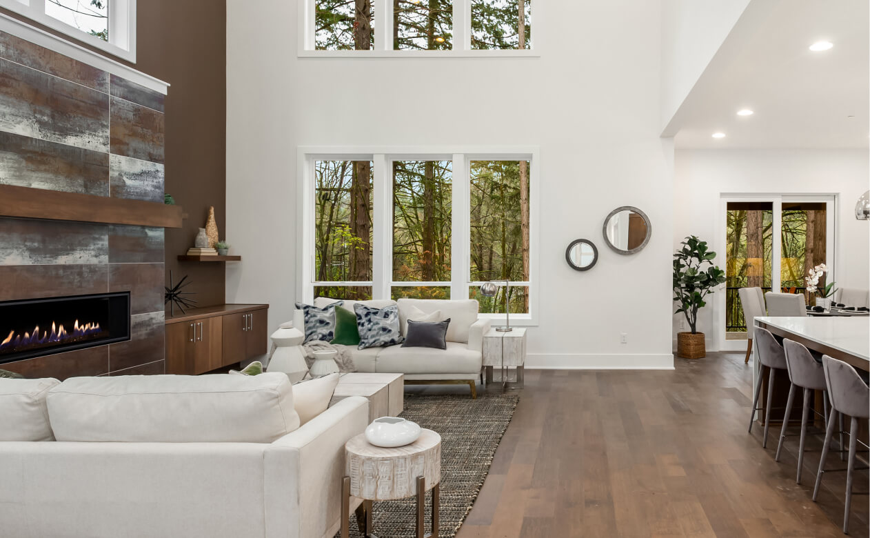 Image of open concept living room with wood look flooring