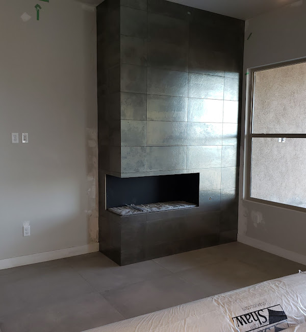 Modern tile fireplace surround installation